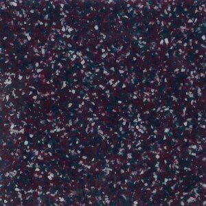 Purple surface with scattered multicolored speckles
