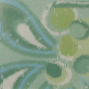 Abstract pattern with green circular elements and swirls