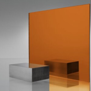Orange mirror acrylic sheet with reflective surface, displaying light reflection and orange-tinted mirror effect