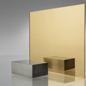 Gold/amber tinted transparent acrylic sheet with metallic finish, displaying warm metallic glow and shadow
