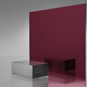 Deep burgundy/maroon tinted transparent acrylic sheet with metallic finish, displaying rich color depth and reddish shadow cast