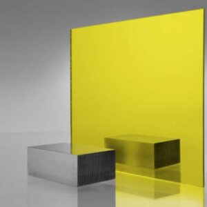 Bright yellow tinted transparent acrylic sheet with metallic finish, exhibiting intense lemon-yellow transparency and colored light projection