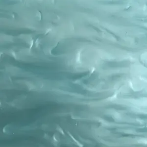 Close-up of a Pearl Turquoise Acrylic Sheet with a swirling blend of vibrant turquoise and pearlescent white hues