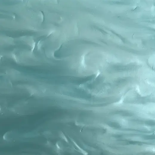 Close-up of a Pearl Turquoise Acrylic Sheet with a swirling blend of vibrant turquoise and pearlescent white hues